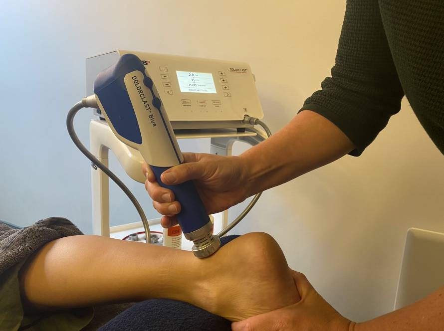 Shockwave equipment being used on achilles tendon