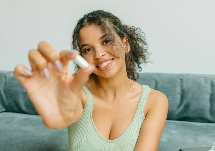 Woman holding supplement